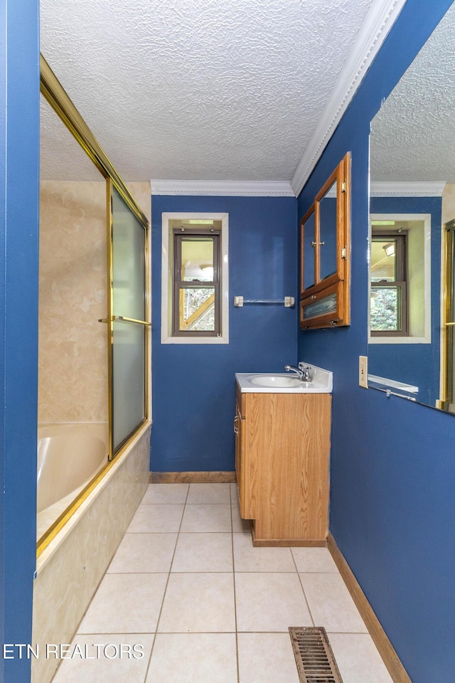 3398 Bell Rd, Sevierville, TN 37862 - bathroom featuring tile patterned flooring, vanity, bath / shower combo with glass door, a textured ceiling, and crown molding