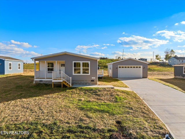 view of front of property featuring a garage, a front lawn, an outdoor structure, and a porch