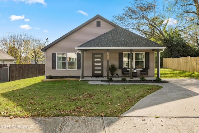 bungalow with a front lawn and covered porch