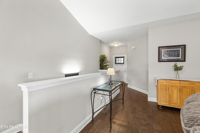 hallway featuring dark hardwood / wood-style flooring