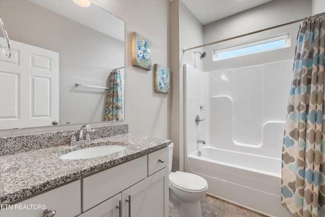 full bathroom with toilet, shower / tub combo, and vanity