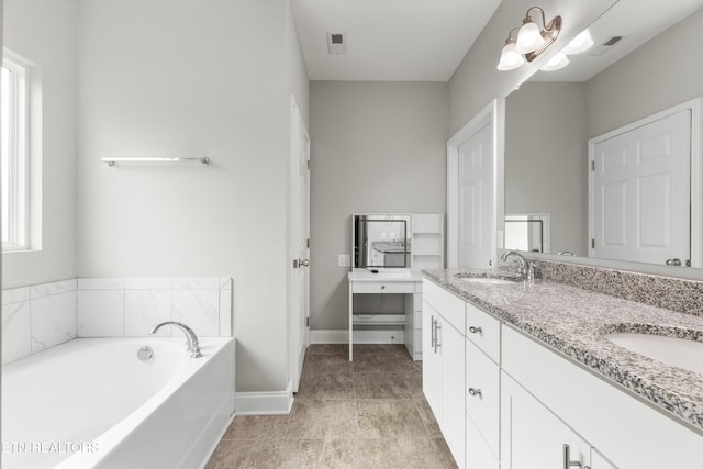 bathroom featuring vanity and a bathing tub