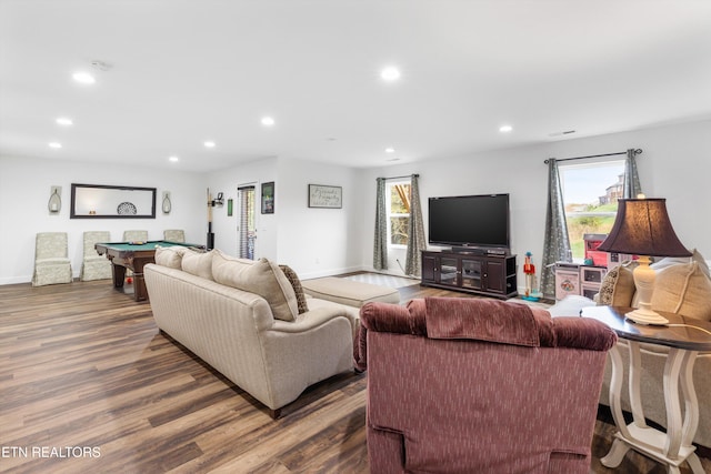 living room with billiards and dark wood-type flooring