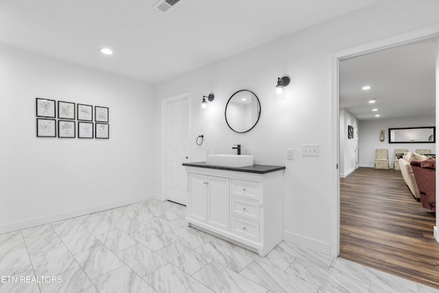 bathroom featuring vanity and hardwood / wood-style floors