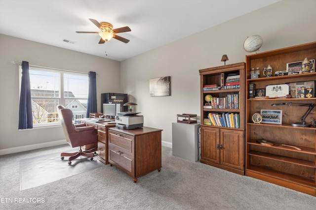 carpeted office with ceiling fan