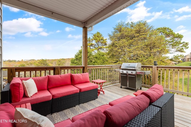 wooden deck featuring area for grilling and an outdoor hangout area