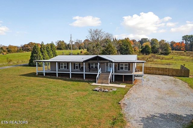 view of front facade featuring a front lawn and covered porch