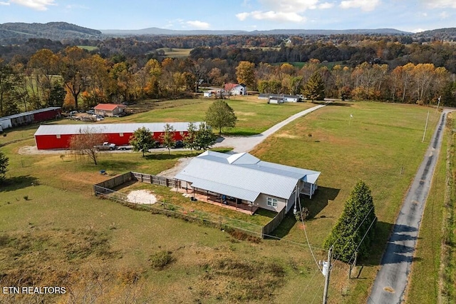 drone / aerial view featuring a mountain view and a rural view