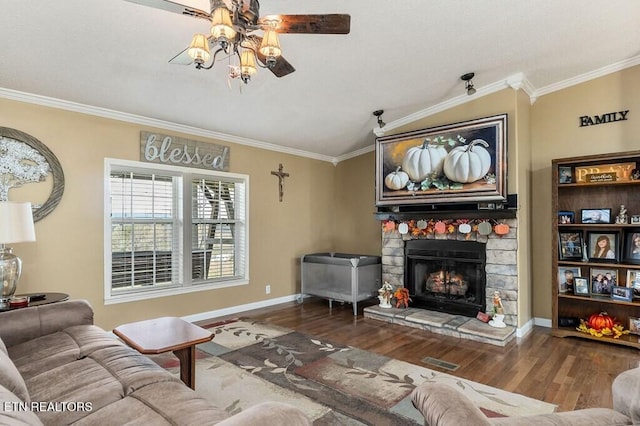 living room featuring a fireplace, hardwood / wood-style flooring, ceiling fan, and ornamental molding