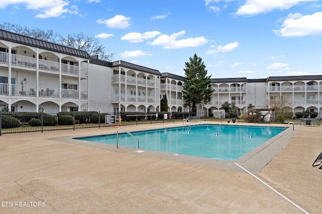 view of swimming pool with a patio area