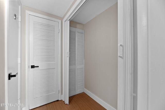 hallway featuring hardwood / wood-style flooring