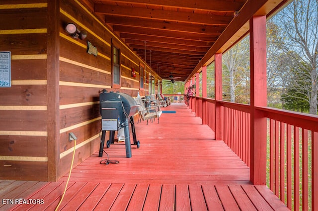 wooden terrace featuring grilling area