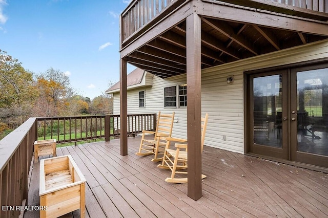 wooden terrace featuring french doors