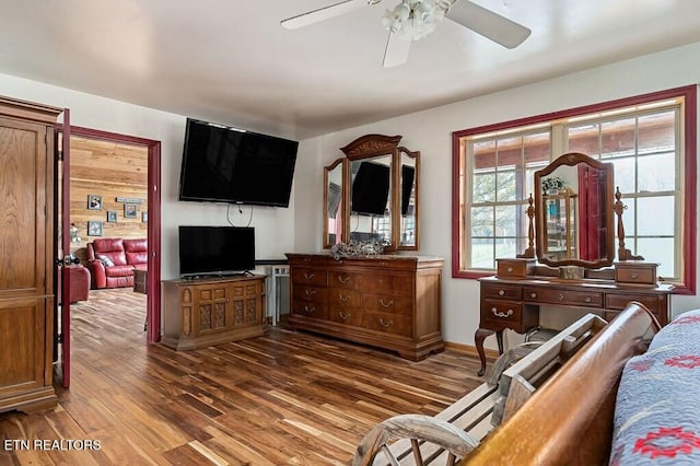 living room with hardwood / wood-style floors and ceiling fan