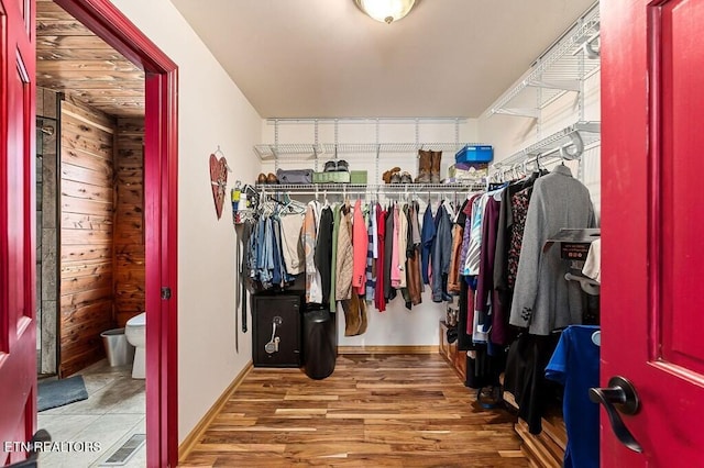 walk in closet featuring hardwood / wood-style flooring