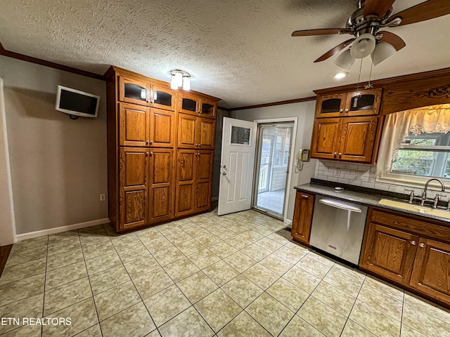 kitchen featuring dishwasher, sink, light tile patterned floors, ceiling fan, and backsplash