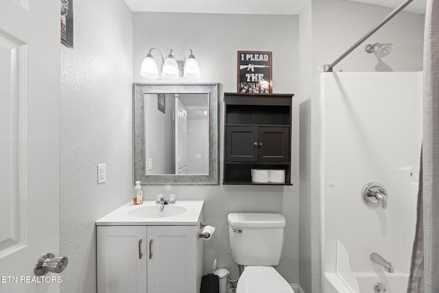 full bathroom featuring vanity, toilet, and washtub / shower combination