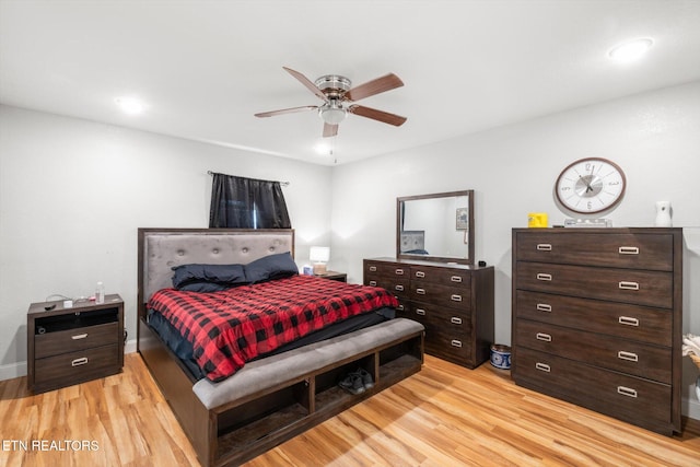 bedroom featuring light wood-type flooring and ceiling fan