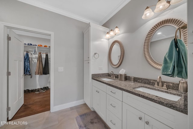 bathroom featuring vanity, tile patterned flooring, and ornamental molding