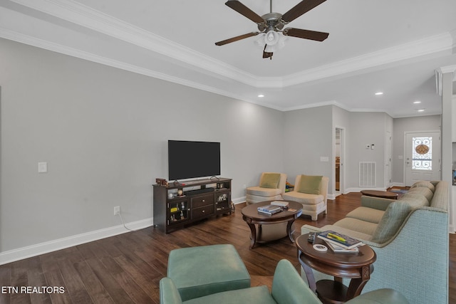 living room featuring dark wood-type flooring, ceiling fan, and crown molding