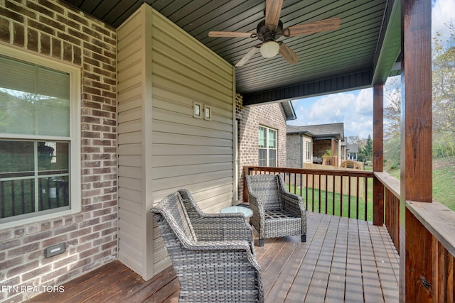 wooden deck with ceiling fan