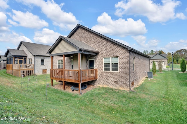 back of house with central air condition unit, a lawn, and a deck