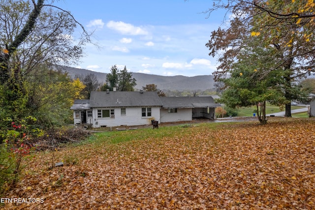 rear view of house with a mountain view