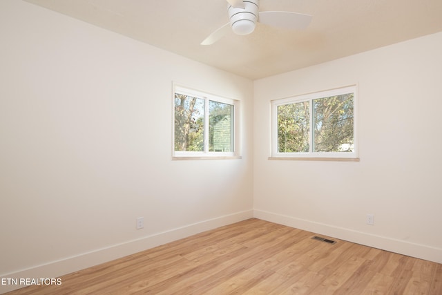 unfurnished room with light hardwood / wood-style floors and ceiling fan