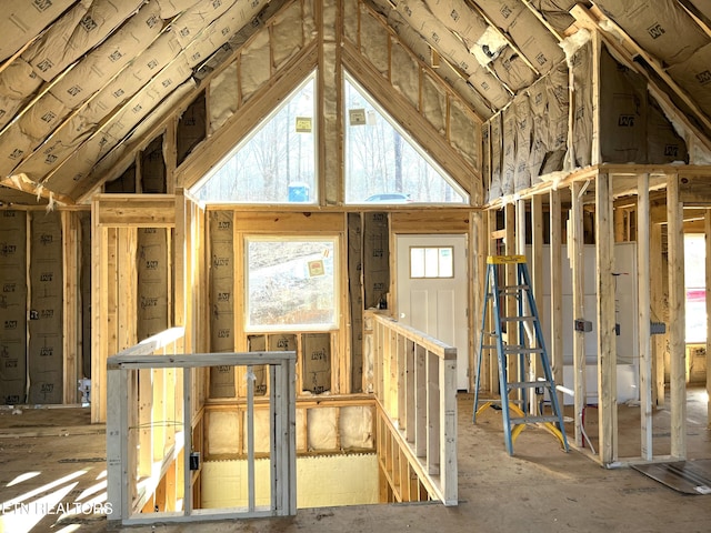 unfinished attic with an upstairs landing