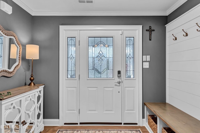 entrance foyer with light wood-type flooring and ornamental molding