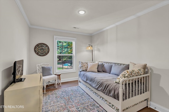 interior space featuring wood-type flooring and ornamental molding