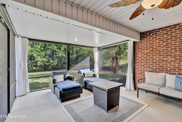 sunroom / solarium with a wealth of natural light and ceiling fan