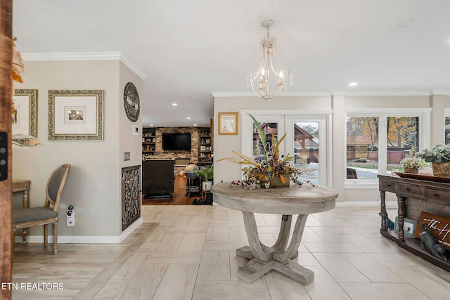 interior space with an inviting chandelier, french doors, ornamental molding, and light hardwood / wood-style flooring