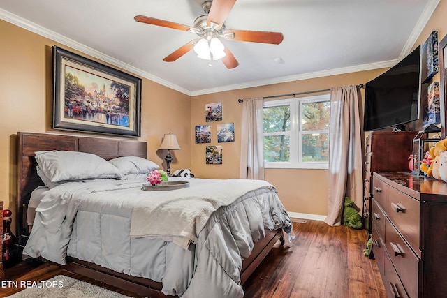 bedroom featuring dark hardwood / wood-style flooring, ceiling fan, and crown molding