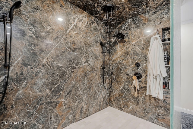 bathroom featuring a tile shower