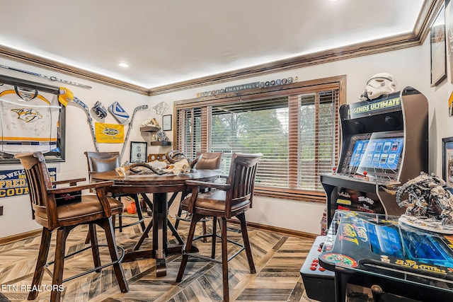 dining room with parquet flooring and ornamental molding