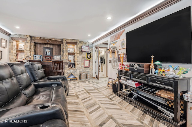 living room with light parquet flooring, indoor bar, and crown molding