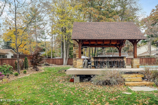 view of yard featuring an outdoor bar and a gazebo