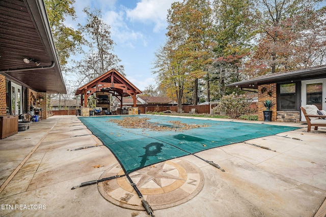 view of pool with a patio and a gazebo