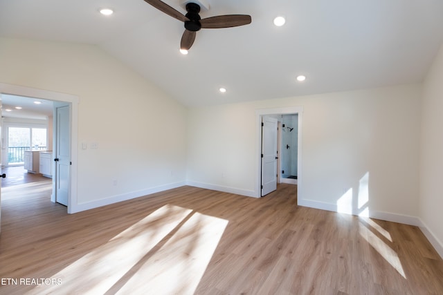 spare room with light hardwood / wood-style floors, lofted ceiling, and ceiling fan