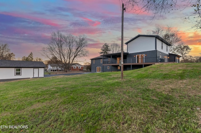 view of yard at dusk