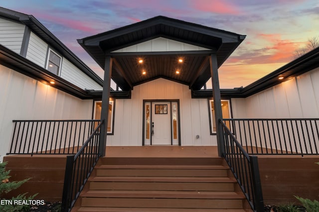 view of exterior entry at dusk