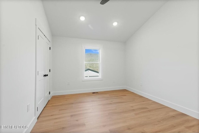 empty room with light hardwood / wood-style floors