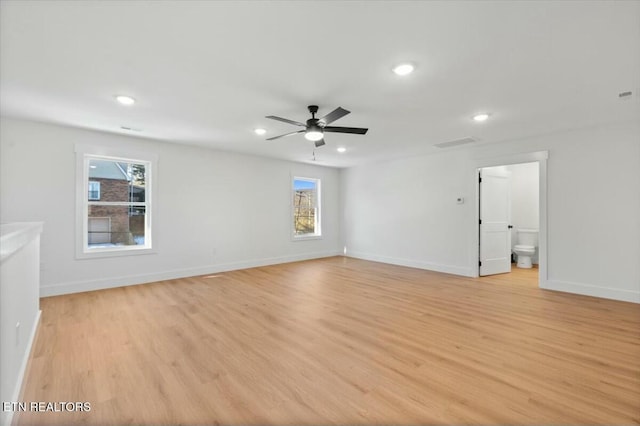 spare room with light hardwood / wood-style floors and ceiling fan