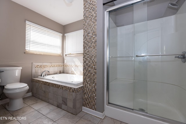 bathroom featuring toilet, shower with separate bathtub, and tile patterned flooring