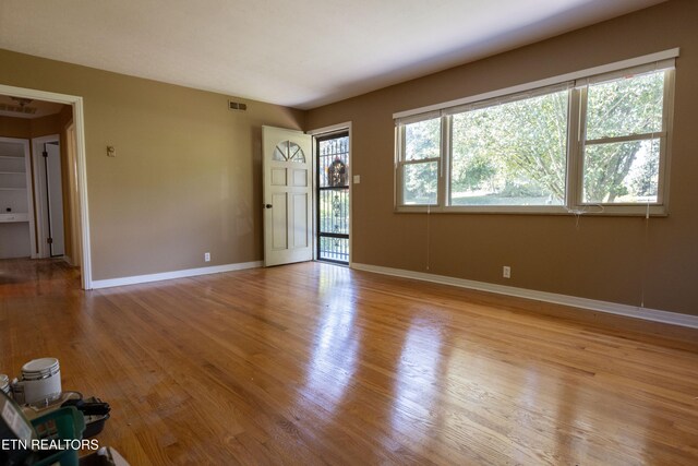 unfurnished room featuring light hardwood / wood-style flooring