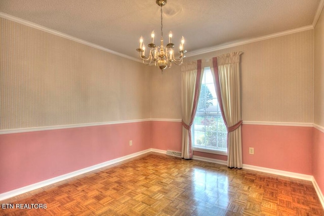 spare room featuring a textured ceiling, an inviting chandelier, parquet flooring, and crown molding