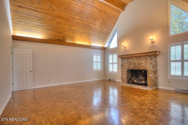 unfurnished living room featuring a stone fireplace, high vaulted ceiling, parquet flooring, and wooden ceiling