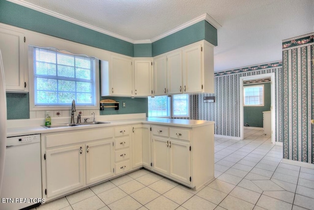 kitchen with white cabinetry, a textured ceiling, sink, dishwasher, and kitchen peninsula