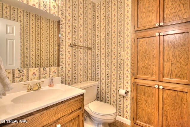 bathroom with vanity and toilet